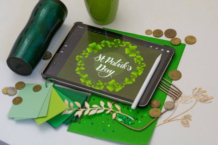 black tablet computer on green table